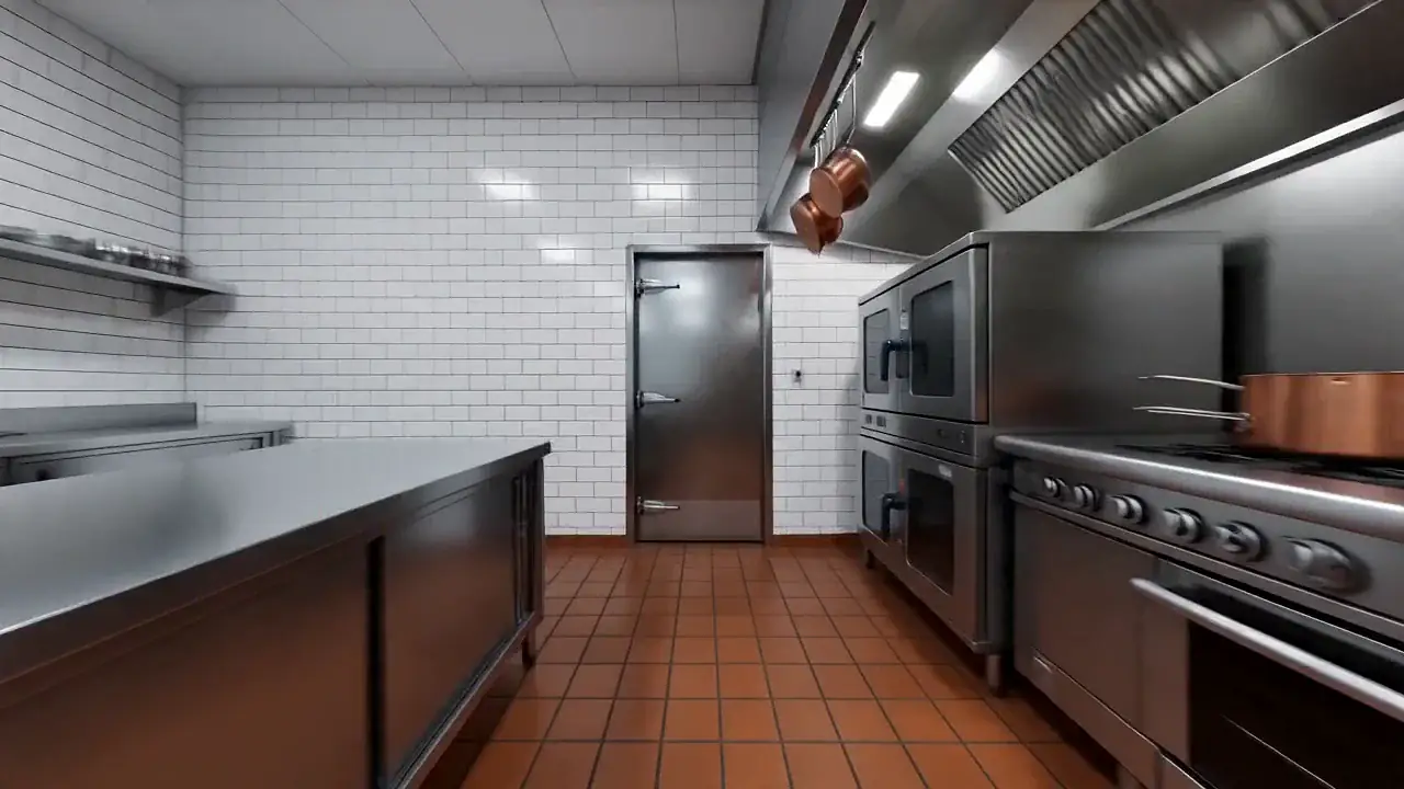 Stainless steel walk-in cooler door with heavy-duty hinges and latch in a commercial kitchen